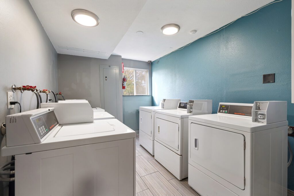 Guest laundry area with washers and dryers at Kennewick Inn & Suites Tri Cities.