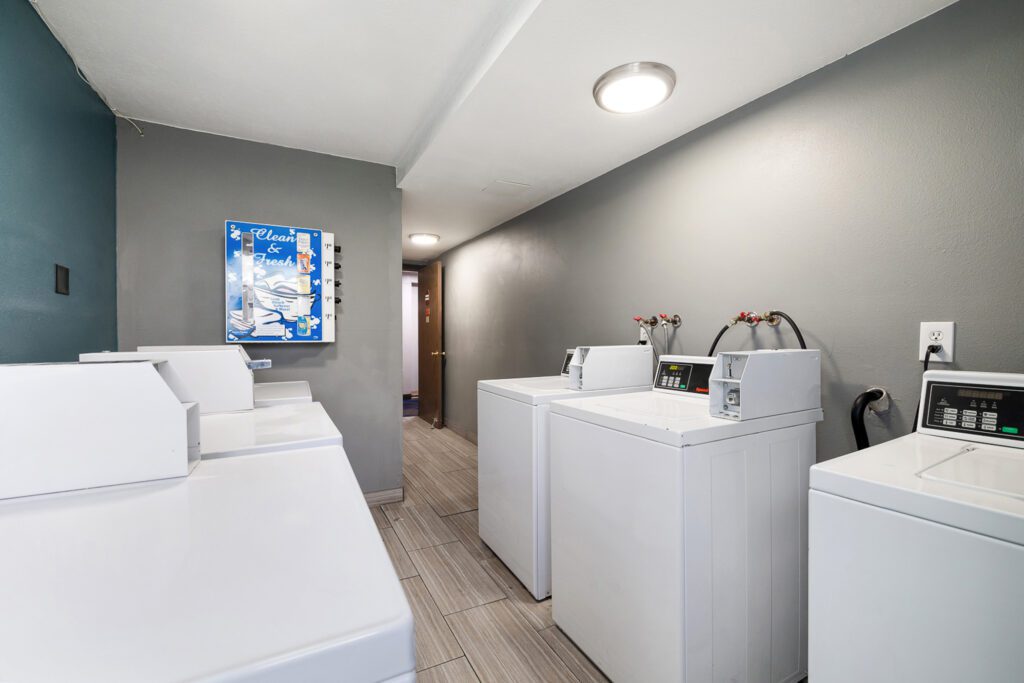Guest laundry area with washers and dryers at Kennewick Inn & Suites Tri Cities.