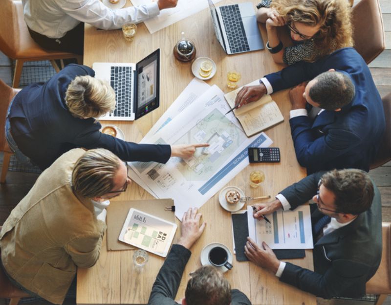 business people working at a desk - overhead photo