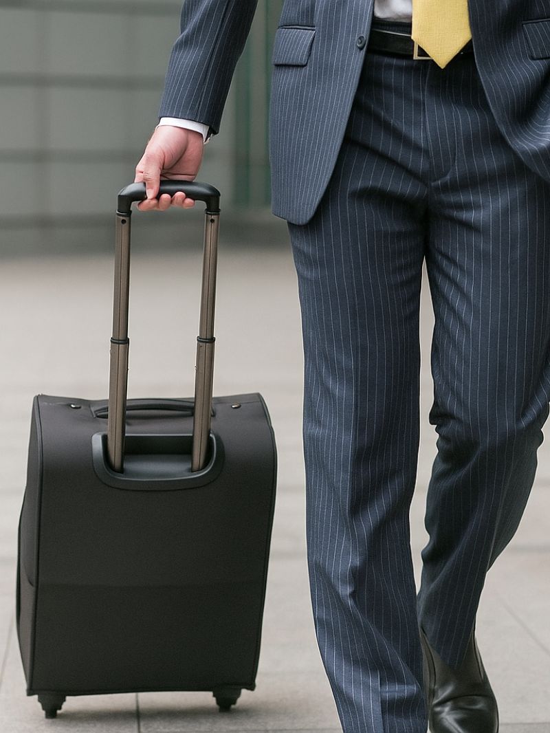 Man pulling his luggage at the airport
