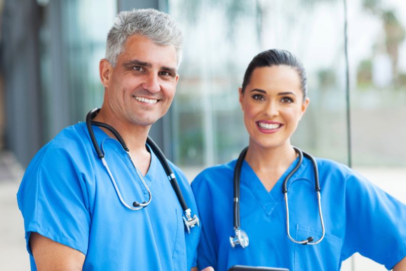 Doctor and nurse smiling